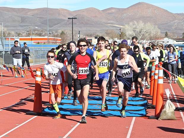 Runners cross the timing mat Saturday at the start of the Safe and Sober 5k Saturday at Carson High.
