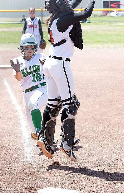 Fallon junior Paige Thorn slides under Fernley catcher Serena Olsen&#039;s tag duirng the Vaqueros 5-4 win in the Northern Division I-A title game on Saturday in Dayton.