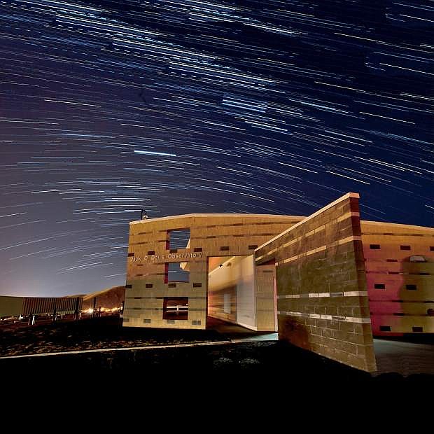 A photograph of the Jack C. Davis Observatory taken over a 40-minute duration.