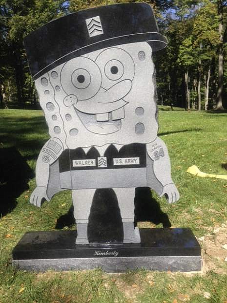 In this Thursday, Oct. 10, 2013, photo provided by the family of Kimberly Walker,  shows Walker&#039;s gravestone in the likeness of popular cartoon character SpongeBob SquarePants. Despite getting prior approval for the gravestone from Spring Grove Cemetery in Cincinnati, the cemetery recently removed it, saying it did not fit in with the character of the historic and picturesque cemetery.   (AP Photo/Kara Walker)