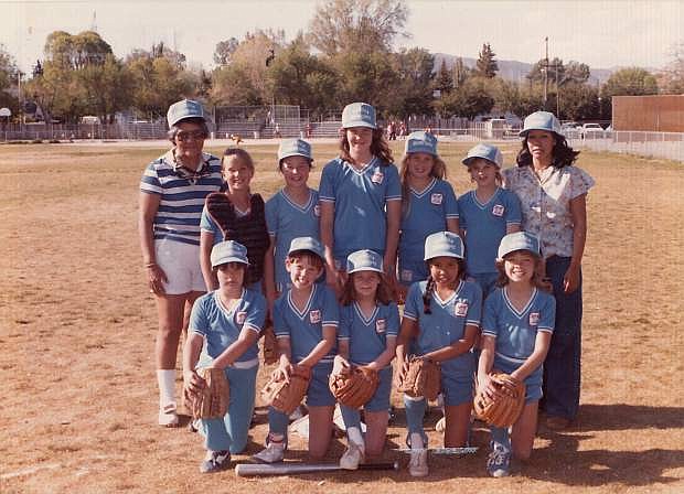 Jean McNicoll, left, and Myrna Rivera with the 1983 Carson City Bobby Sox team they coached. The sisters are organizing a reunion of female athletes from the 60s-80s.