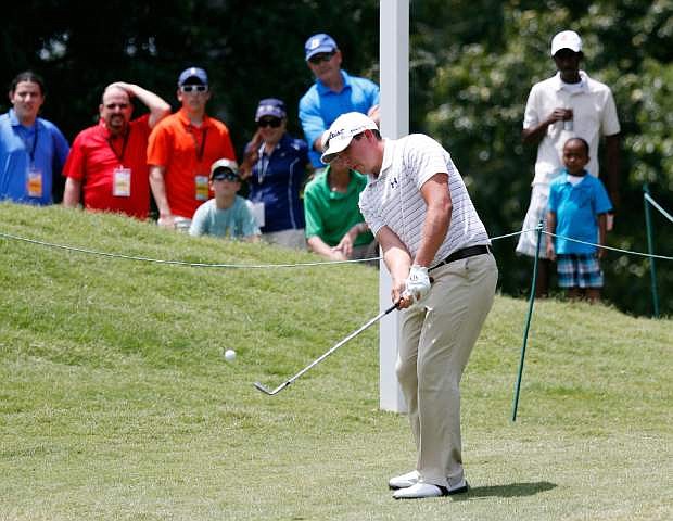 Scott Stallings chips to the sixth hole during the third round of the St. Jude Classic golf tournament Saturday, June 8, 2013, in Memphis, Tenn. (AP Photo/Rogelio V. Solis)