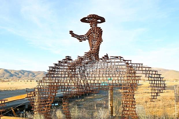 One of artist Paulo Cividino&#039;s &#039;Explorer&#039; sculptures overlooks I-580 in Carson City from the 5th St. bridge Wednesday.