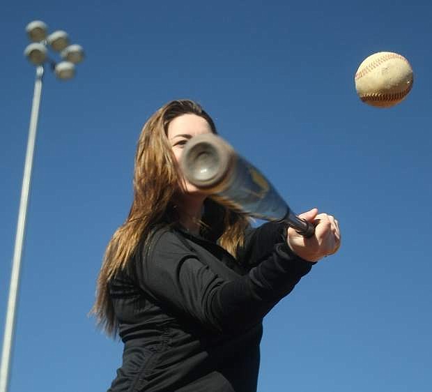 Carson City resident Kennedy Ogle takes advantage of a warm bluebird day to hit some baseballs at Governors Field on Monday.
