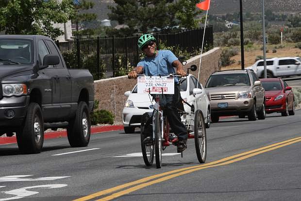 Glen Lucky, 61, of Indian Hills pedals his trike into the Topsy Lane shopping center on Friday. He recently celebrated his sixty-first birthday with a trip to the Baseball Hall of Fame in Cooperstown, New York.