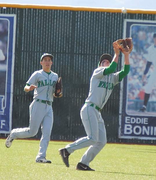 Greenwave shortstop Sage Moir catches a deep pop fly as Mo Coverston looks on during the Wave&#039;s 9-2 loss to Faith Lutheran in the Division I-A state title game Saturday at Peccole Park in Reno.
