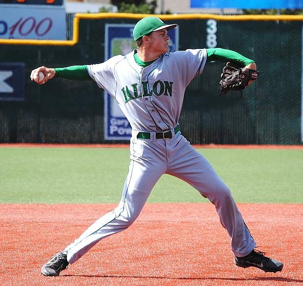 Greenwave third baseman Riley Williams throws to first base for an out during the Wave&#039;s 9-2 loss to Faith Lutheran in the Division I-A state title game in May.