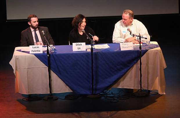 Discussing State Ballot Question 3 at a public forum on Tuesday night are, from left, Lucas Foletta, Dilek Uz and Danny Thompson.