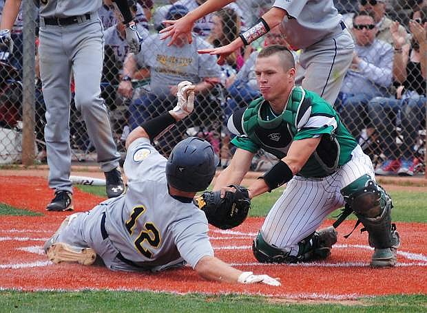 Fallon catcher Tyler Bagby tags out a Boulder City runner during Fallon&#039;s 8-2 win on Thursday in Las Vegas.
