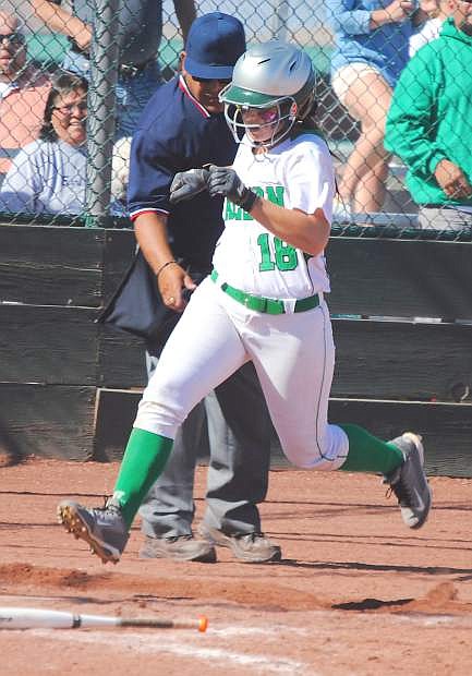 Paige Thorn scores the winning run as the Lady Wave beat Boulder City, 5-4, in Friday&#039;s Division I-A state tournament.