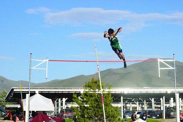 Fallon pole vaulter Nathan Heck skies over the bar during the Northern Division I-A regional meet in Winnemucca last week. The Greenwave compete at the DI-A state meet in Carson City today and Saturday.