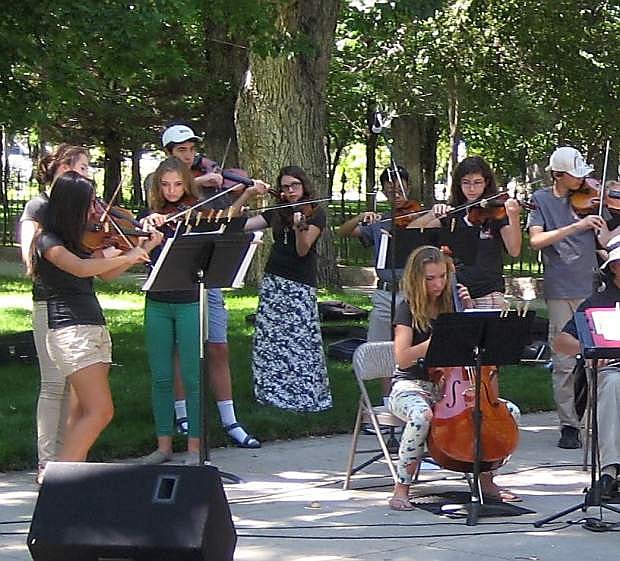 Strings in the Schools students perform last summer at the Legislative Plaza.