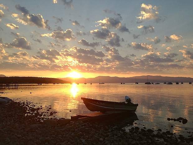 The sun rises over Lake Tahoe, as seen from Commons Beach in Tahoe City on Aug. 10. The 2015 Lake Tahoe Environmental Summit in Zephyr Cove will cover a variety of issues pertaining to Lake Tahoe on Monday, Aug. 24.