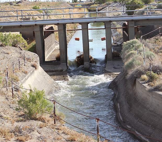 Water flows from the Truckee Canal into Lahontan Reservoir on Sunday morning.