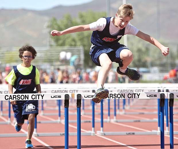 Eagle Valley&#039;s William Ore clears a hurdle in the 7th grade 80-meter event at the Tah-Neva Championships Wednesday at Carson High School.