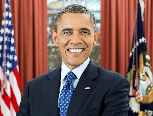 President Barack Obama is photographed during a presidential portrait sitting for an official photo in the Oval Office, Dec. 6, 2012.