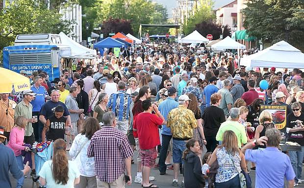 Several thousand people fill downtown Carson City for the 21st annual Taste of Downtown on Saturday. The event, which features more than 40 local restaurants, is the major fundraiser for Advocates to End Domestic Violence.