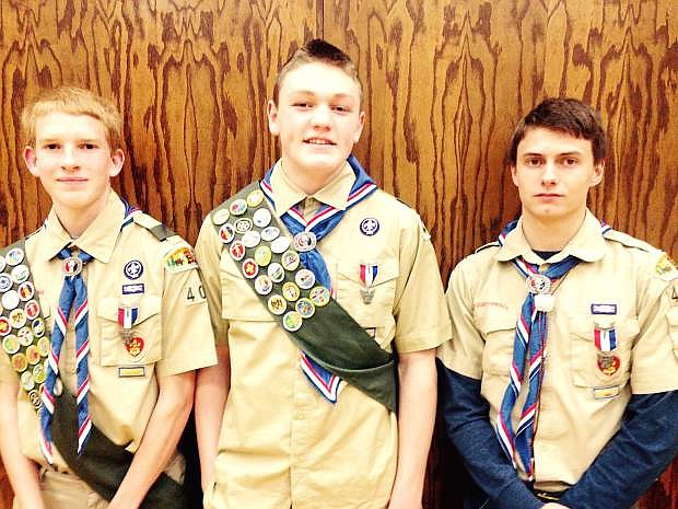 Matthew Fowler, 15, Carson Crosby, 16, and Aaron Galloway, 16, received their Eagle Scout awards Tuesday evening at the Church of Jesus Christ of Latter-day Saints in Dayton.