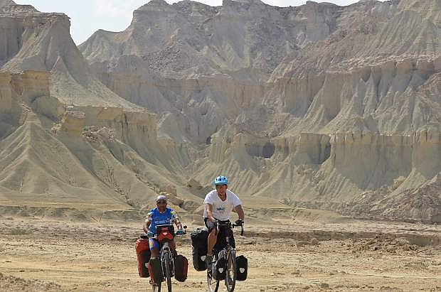 Mohammad Tajeran and Rick Gunn ride their bikes across Qeshm. The two are collaborating on a TEDx Talk in Iran next month.