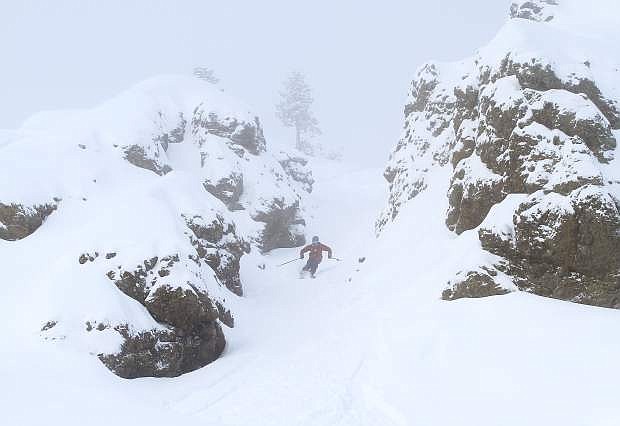 A skier charges through a gully at Kirkwood Mountain Resort.