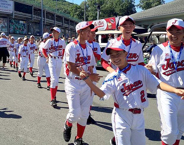 The Japan team walks into the opening ceremonies of the Little League World Series.