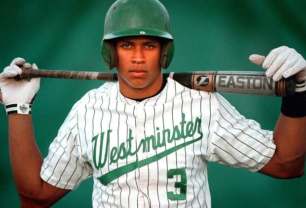 FILE- This 1990s file photo shows baseball player Alex Rodriguez when he played for Westminster Christian high school in Miami. Three MVP awards, 14 All-Star selections, two record-setting contracts and countless controversies later, A-Rod is the biggest and wealthiest target of an investigation into performance-enhancing drugs, with a decision from baseball Commissioner Bud Selig expected on Monday, Aug. 5, 2013. (AP Photo/Miami Herald, David Bergman, File)