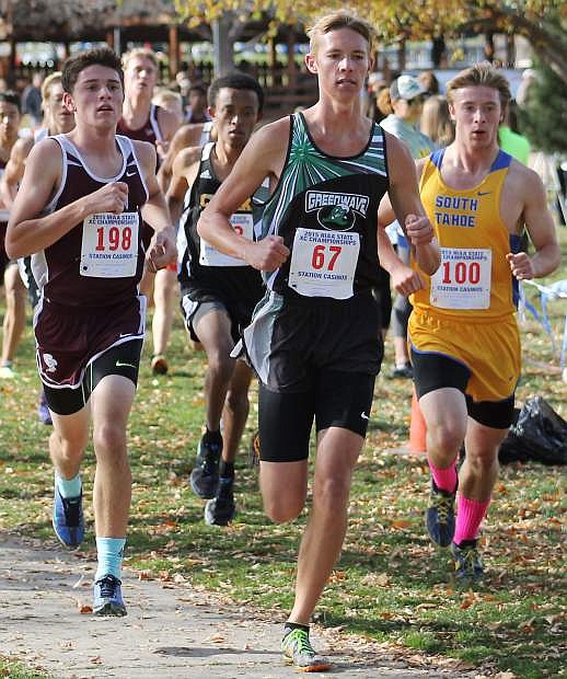 Tristen Thomson, center, racing for the state title in cross country in 2015.