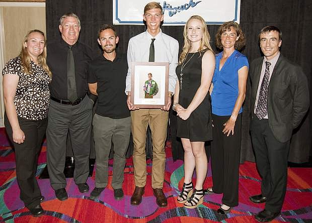 Tristen Thomson, center, is surrounded by his family and coaches including, from left, parents Summer and Tommy Thomson, coach Lupe Cabada, girlfriend Savannah Sweeney and coaches Sarah Raitter and Mitch Overlie.