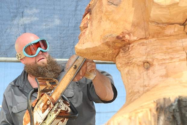 Matthew Welter of Timeless Sculptures works on the Sphinx sculpture.