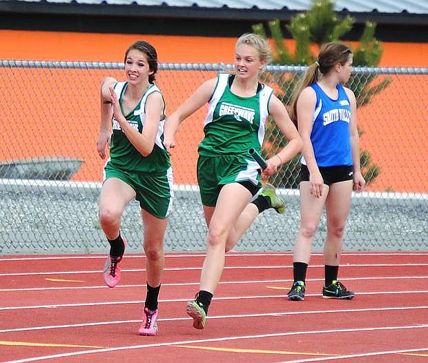 Fallon&#039;s Whitney Skabelund, right, hands off the baton to Brynlee Shults during the 4x100 relay on Saturday at Fernley.