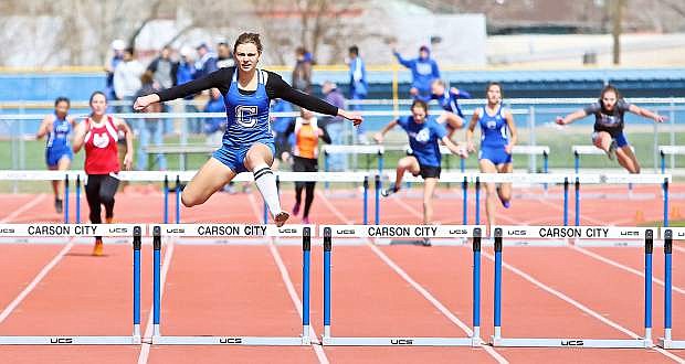 Carson&#039;s Athena Favero runs the 300 hurdles during a recent meet.