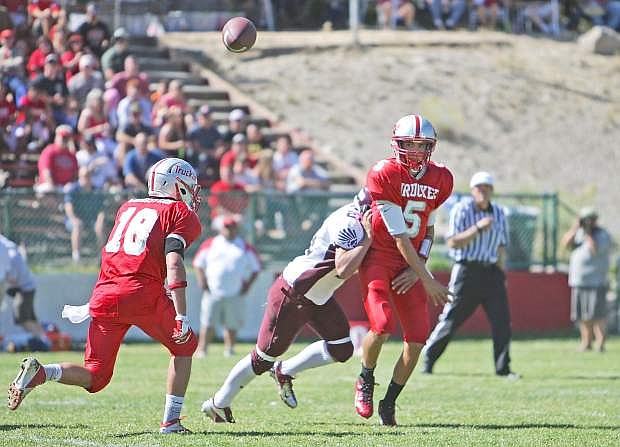 Louden Smith, then a junior, throws a pass during a regular-season game last season. Smith and the Wolverines will look to defend their four consecutive state championships when the season kicks off Sept. 6 at Lowry.