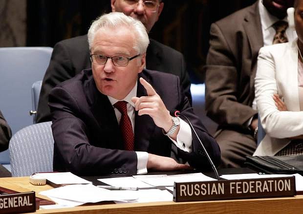 Russian Federation Ambassador Vitaly Churkin addresses the United Nations Security Council,  Friday, May 2, 2014. The U.N. Security Council is meeting in emergency session on Ukraine after Russia called for a public meeting on the growing crisis there. (AP Photo/Richard Drew)