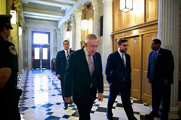 Senate Majority Leader Harry Reid of Nev. makes his way to the Senate floor on Capitol Hill in Washington, Friday, Sept. 6, 2013, to introduce a resolution to authorize military action to support President Barack Obama&#039;s request for a strike against Syria.  (AP Photo/J. Scott Applewhite)