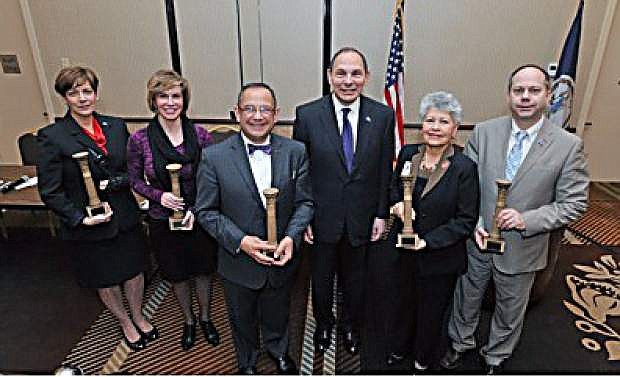 Honored in Washington, D.C., at the opening of the National Association of State Directors of Veterans Affairs conference are, from left to right, Kat Miller, director of Nevada Department of Veterans Services; Tina Richardson, Michigan Veterans Affairs Agency; Dr. Vito Imbasciani, secretary of Department of Veterans Affairs; Bob McDonald, Department of Veterans Affairs secretary; Lourdes E. Alvarado Ramos, director of Department of Veterans Affairs;  and Lonnie Wangen, commissioner of North Dakota Department of Veterans Affairs.