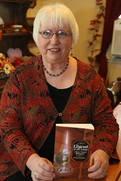 Kristin Ruggaber with her book, &#039;The Legend of the Lamp,&#039; at home in Virginia City.