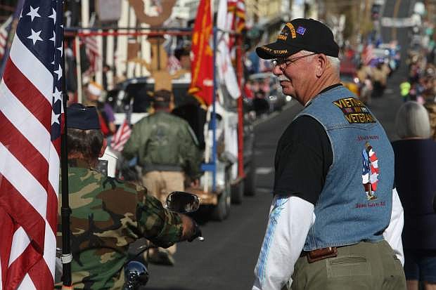 Fernley resident and Viet Nam war veteran Harry Wheeler watches the Veterans Day parade in Virginia City on Monday.