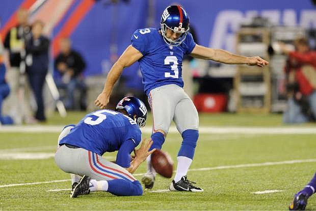 New York Giants kicker Josh Brown (3) kicks a field goal during the second half of an NFL football game against the Minnesota Vikings Monday, Oct. 21, 2013 in East Rutherford, N.J. (AP Photo/Bill Kostroun)