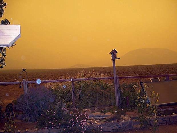 The sun is seen through the smoke from the Gardnerville Ranchos on Thursday afternoon.
