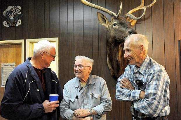 Wally Bennett, left, Don Lane and Dick Lane visit during the 151st  anniversary of the founding of Warren Engine Company #1. The company is believed to be the oldest continuously operating volunteer fire department on the West Coast. The annual business meeting and dinner was held at the Eagles Lodge in Carson City Tuesday June 17, 2014. Bennett joined the department in 1966, Don Lane joined in 1965 and his brother Dick  joined in 1962.