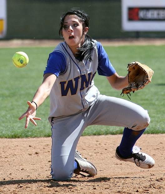 Madison Gonzalez flips the ball to second to record a force out during a game in 2013.