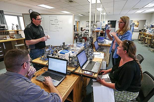 From left front, Matt Anderson, Brendan Buckley, Professor Emily Howarth and Lindsay Moore work in the industrial technology labs at Western Nevada College.