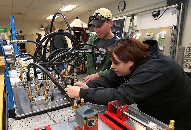 Rebecca Wynters and Josh Fowler work in the AIT lab last fall at Western Nevada College.