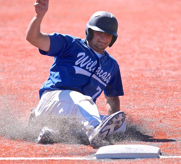 WNC&#039;s Tim Licthy slides safely into 3rd base Friday during a game against Colorado Northwestern.