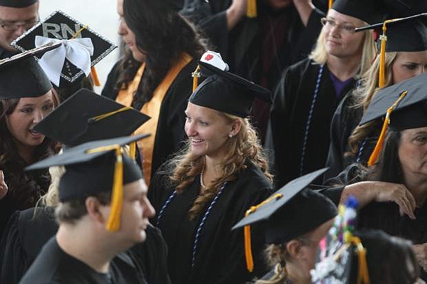 Western Nevada College graduate Rebecca Cornell mingles with her classmates before the start of the commencement ceremony on Monday.