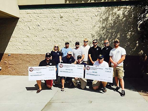 Area veterans from Western Nevada College, Truckee Meadows Community College and the University of Nevada, Reno accept scholarship checks from the Disabled American Veterans Chapter No. 1 in Reno.