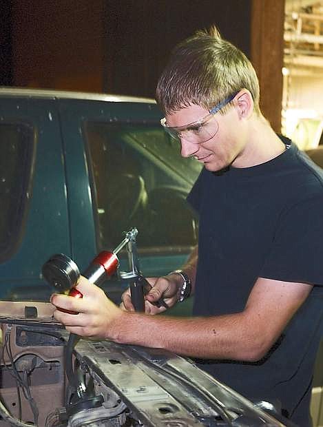 WNC automotive student Bobby Clifford performs a pressure test on his truck&#039;s radiator.