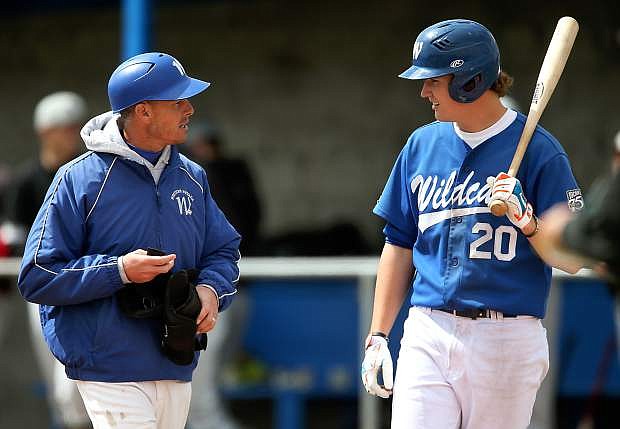 Western Nevada College&#039;s Head Coach DJ Whittemore talks with Cody Reynolds during a game against the College of Southern Idaho at John L. Harvey Field, in Carson City, Nev., on Friday, March 28, 2014.