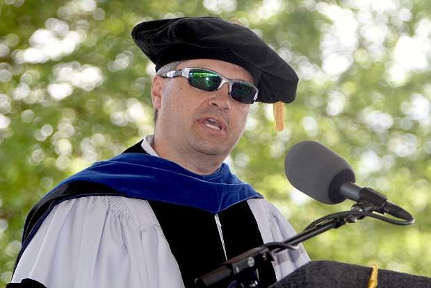 Regent Jason Geddes delivers the commencement address to the 2015 Western Nevada College graduates on Monday.