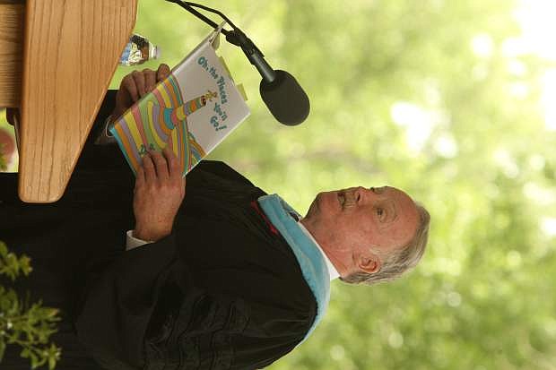 Western Nevada College instructor Dr. Tom Kubistant delivers the commencement address to the 2014 graduating class on Monday.